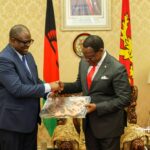 His Lordship the Hon. Chief Justice exchanging gifts with Dr. lazarous Chakwera during the same visit.